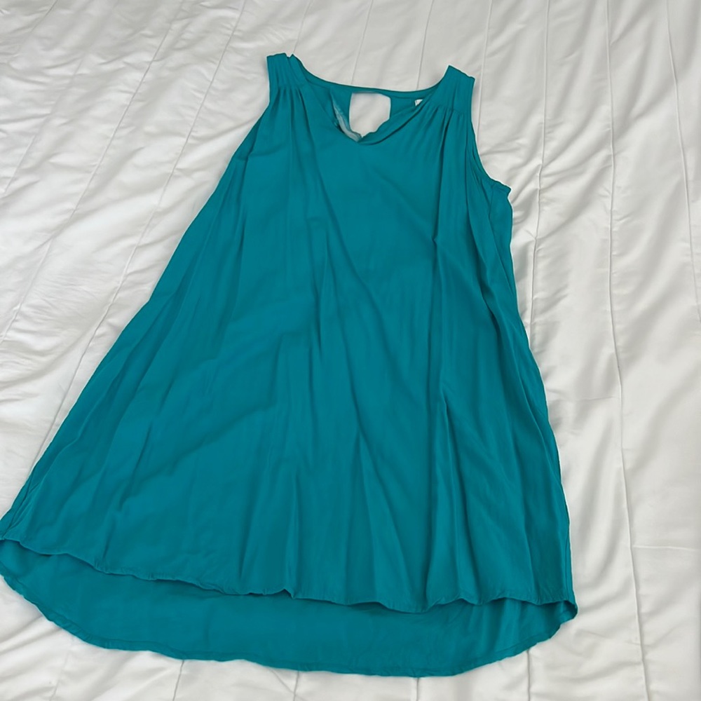 Teal Sleeveless Dress with Keyhole Style Back. Slight high low hem.